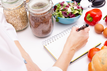 Vegetable diet nutrition and medication concept. Nutritionist offers healthy vegetables diet.