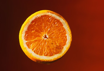 Sliced orange and lemon in water spray