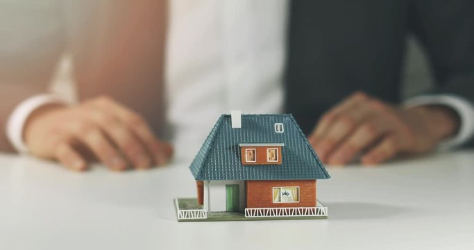 housing development - salesman offering new house to buy concept