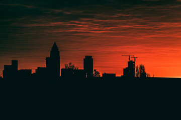Obraz na płótnie Canvas Skyline view with dramatic sunrise