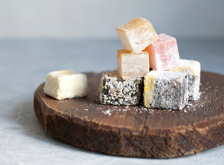  Turkish delight on a wooden tray. Nice dessert.