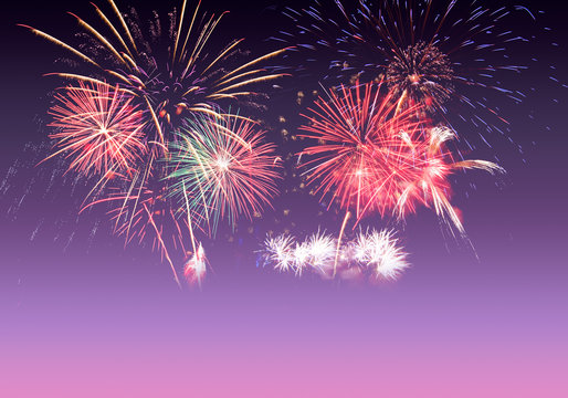 Colourful Fireworks on pink, violet and purple twilight background with copy space to celebrate happy new year or special occasions, holidays event celebration concept in sweet love colour