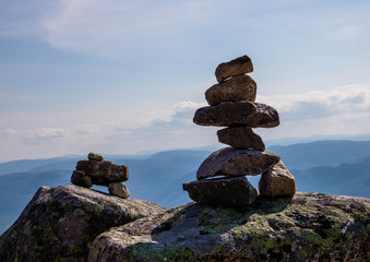 Two inukshuks (cairns) on top of a mountain in Charlevoix. 