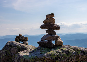 Two inukshuks (cairns) on top of a mountain in Charlevoix. 