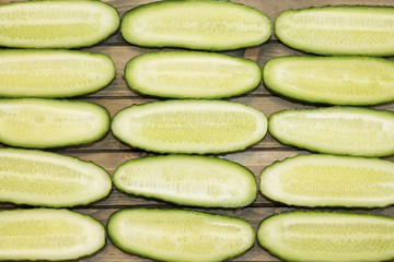 Fresh cucumber, chopped cucumber, isolated on wooden board