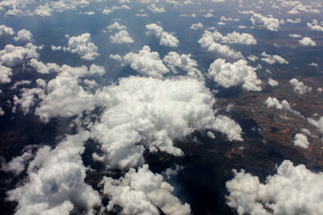 Naklejka na ściany i meble Clouds from a plane window
