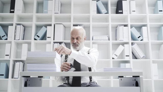 Office worker doing a boring repetitive job