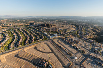 Aerial view of expansion in the City of Los Angeles.  New neighborhood construction in the Porter Ranch area of the San Fernando Valley.    - obrazy, fototapety, plakaty