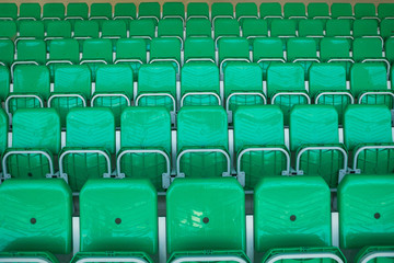 Fototapeta premium Yellow chairs inside the stadium, numbered