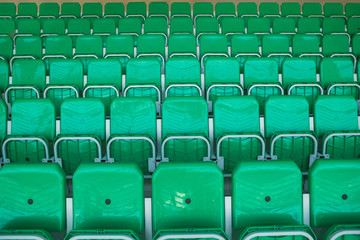 Yellow chairs inside the stadium, numbered