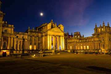 Old fashioned palace lit up at night at christmas