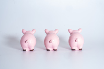 Figures of pigs with coins. Symbol of 2019