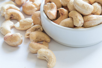 roasted cashew nuts on a white background