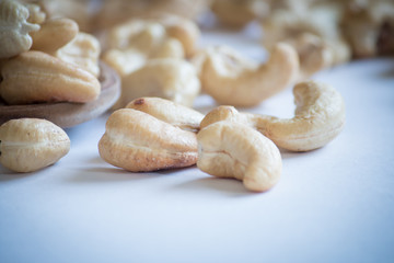 roasted cashew nuts on a white background