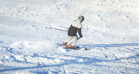 Free ride skier skiing down through fresh powder . Ski with amazing view of swiss famous mountains in beautiful winter , The skituring, backcountry skiing in  snow.