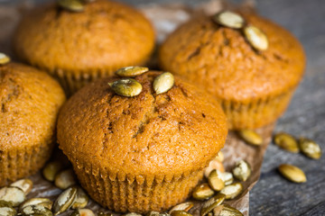 Pumpkin muffins on wooden background. Dietary product. Useful children's dessert. Bright. Seasonal product. Diet. Recipe