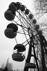 Ferris wheel in amusement park in dead abandoned ghost town of Pripyat, Chernobyl Exclusion Zone, Ukraine