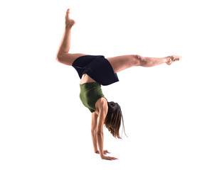Fototapeta premium Young girl dancing in studio on isolated background