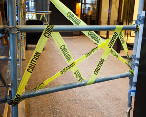 Caution tape scaffolding barrier. 