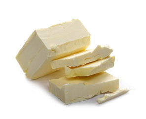 Yellow margarine pieces isolated on white background