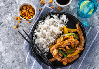 Kung Pao chicken, stir-fried Chinese sichuan traditional sichuan  dish with chicken, peanuts, vegetables and chili peppers.