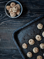 Christmas coconut meringue cookies on baking pan. Overhead shot with copy space.