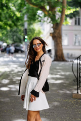 Fototapeta premium Girl posing for the camera with a female bag