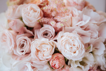 Wedding flowers, bridal bouquet closeup. Decoration made of roses, peonies and decorative plants, close-up, selective focus, nobody, objects
