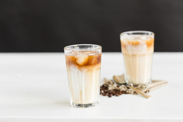 Delicious drink concept - Iced coffee in a glass with ice.