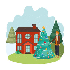 man with christmas tree outside of the house