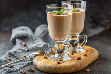 Coffee Panna cotta on milk chocolate in beautiful glasses.