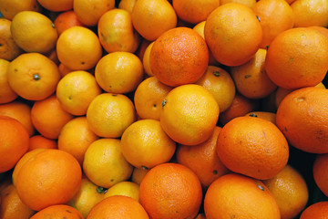 scattered ripe yellow juicy tangerines