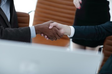 closeup.handshake of business partners on the background of the office