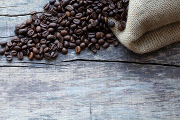 Coffee beans, bag on old wooden background. Сoffee background