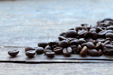 Coffee beans on old wooden background. Сoffee background