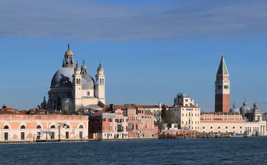 Fototapeta premium Venice, Italy. A view of the island of Dorsoduro taken from Giudecca Canal. The iconic Campanile di San Marco and the church of Santa Maria Della Salute.