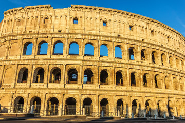 The Colosseum of Rome under the blue summer sky