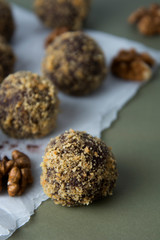 Energy healthy homemade truffles. Uncooked sweet balls made from walnuts and biscuits.