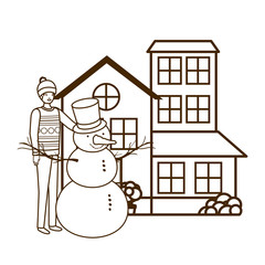 man with snowman outside of the house