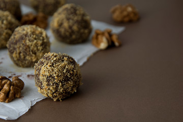 Energy healthy homemade truffles. Uncooked sweet balls made from walnuts and biscuits.