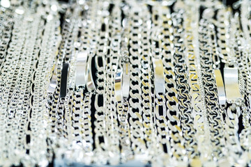 Silver chainlets in showcase of jewellery store