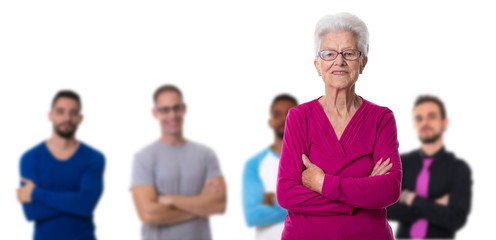 Cheerful senior woman with guys in background