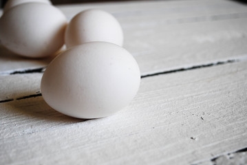Chicken white eggs close-up on the table