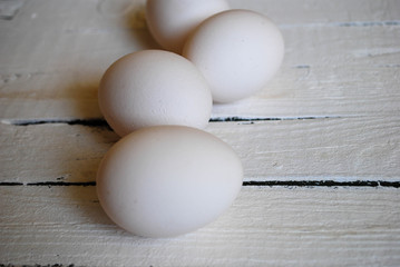 Chicken white eggs close-up on the table