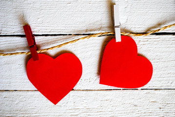 Valentine's Day, paper hearts on wooden background