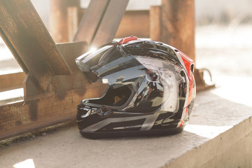 Modern motorcycle helmet on urban bright background