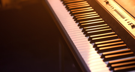 piano keys close-up, on a beautiful colored background