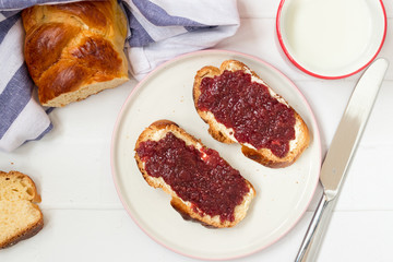 Traditional sweet bread with homemade jam, top view.