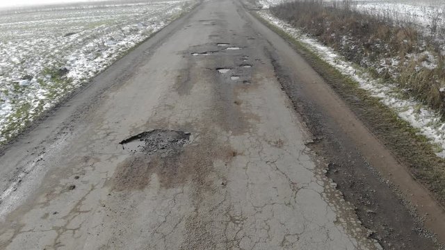 Destroyed road, difficult traffic area, threat of traffic accident