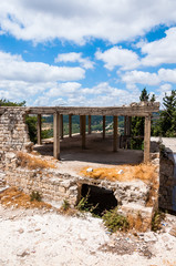 Fototapeta na wymiar Concrete frame of the abandoned building in Old Town of Sefed with panorama to the North nature of Israel